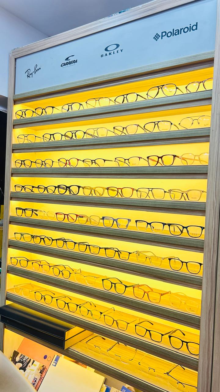 Ray-Ban, Oakley, Carrera & Polaroid frame wall — Eye Vision Opticians